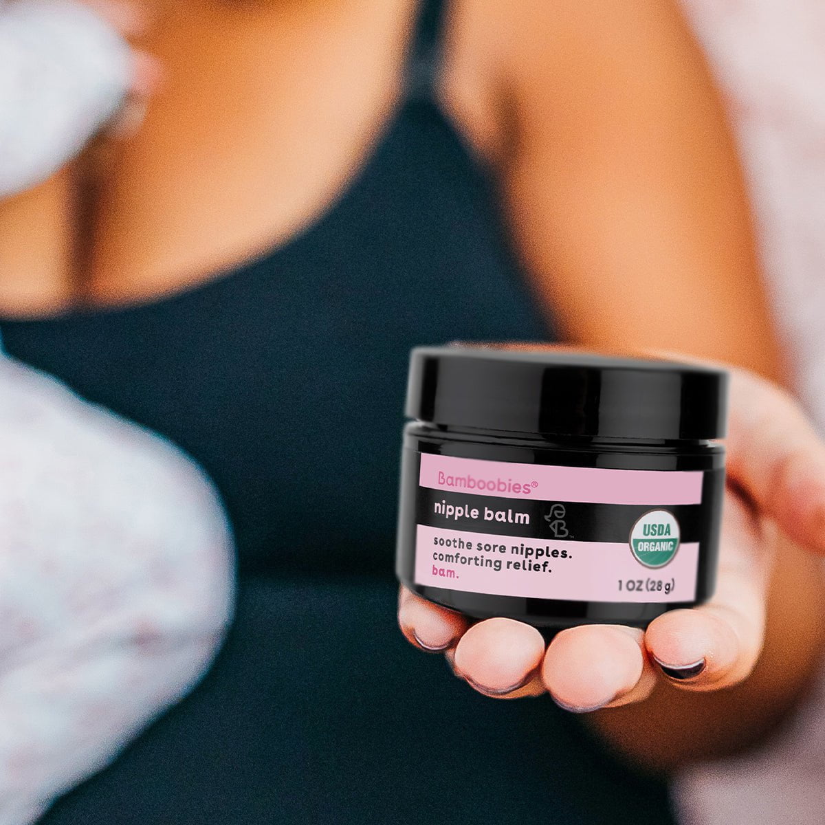 Mom holding a jar of nipple balm | Bamboobies