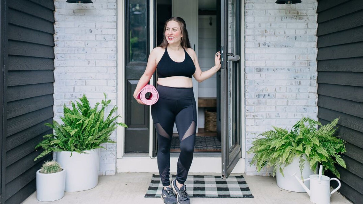 woman in bamboobies bra walking with yoga mat