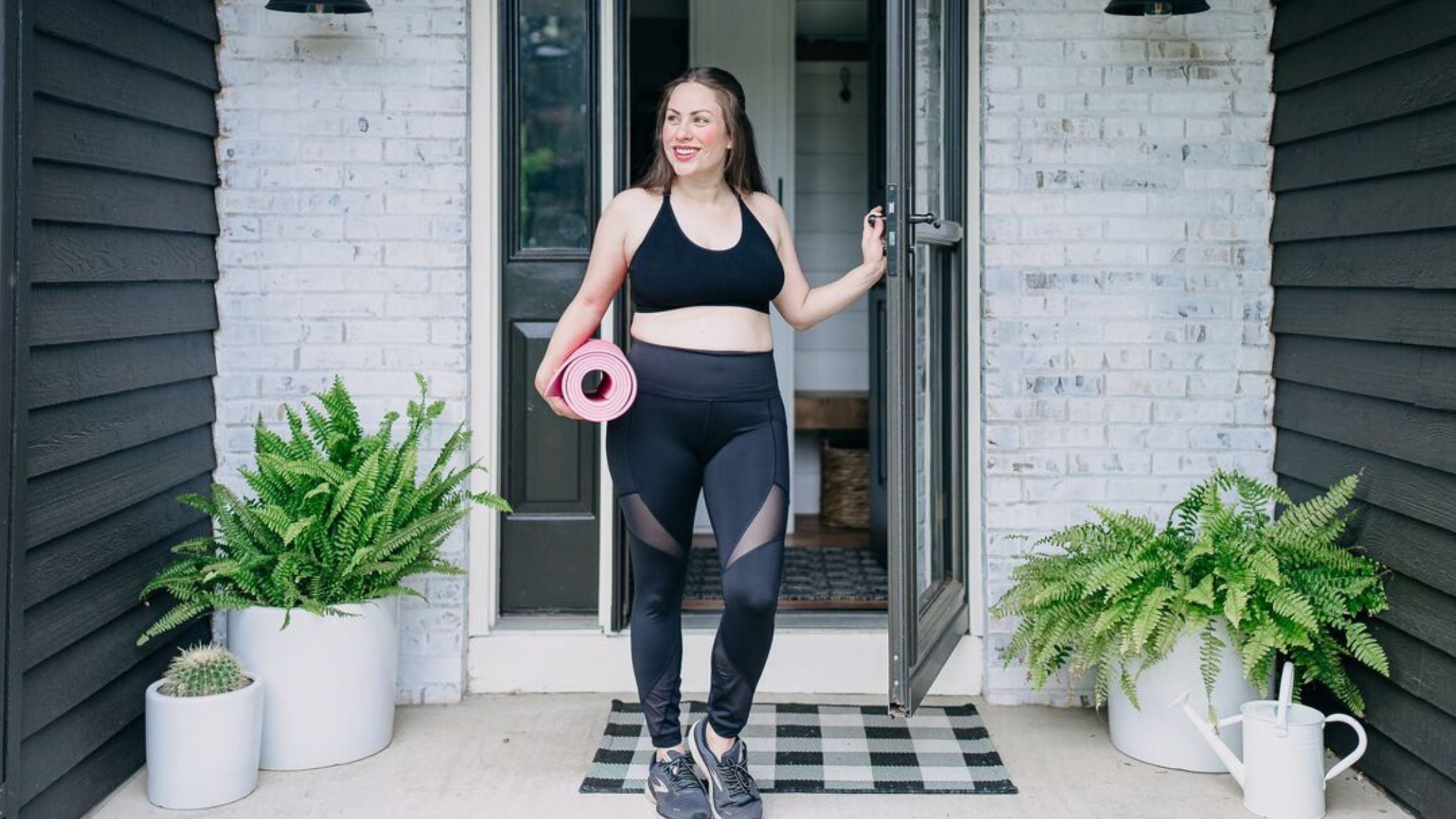 woman in bamboobies bra walking with yoga mat